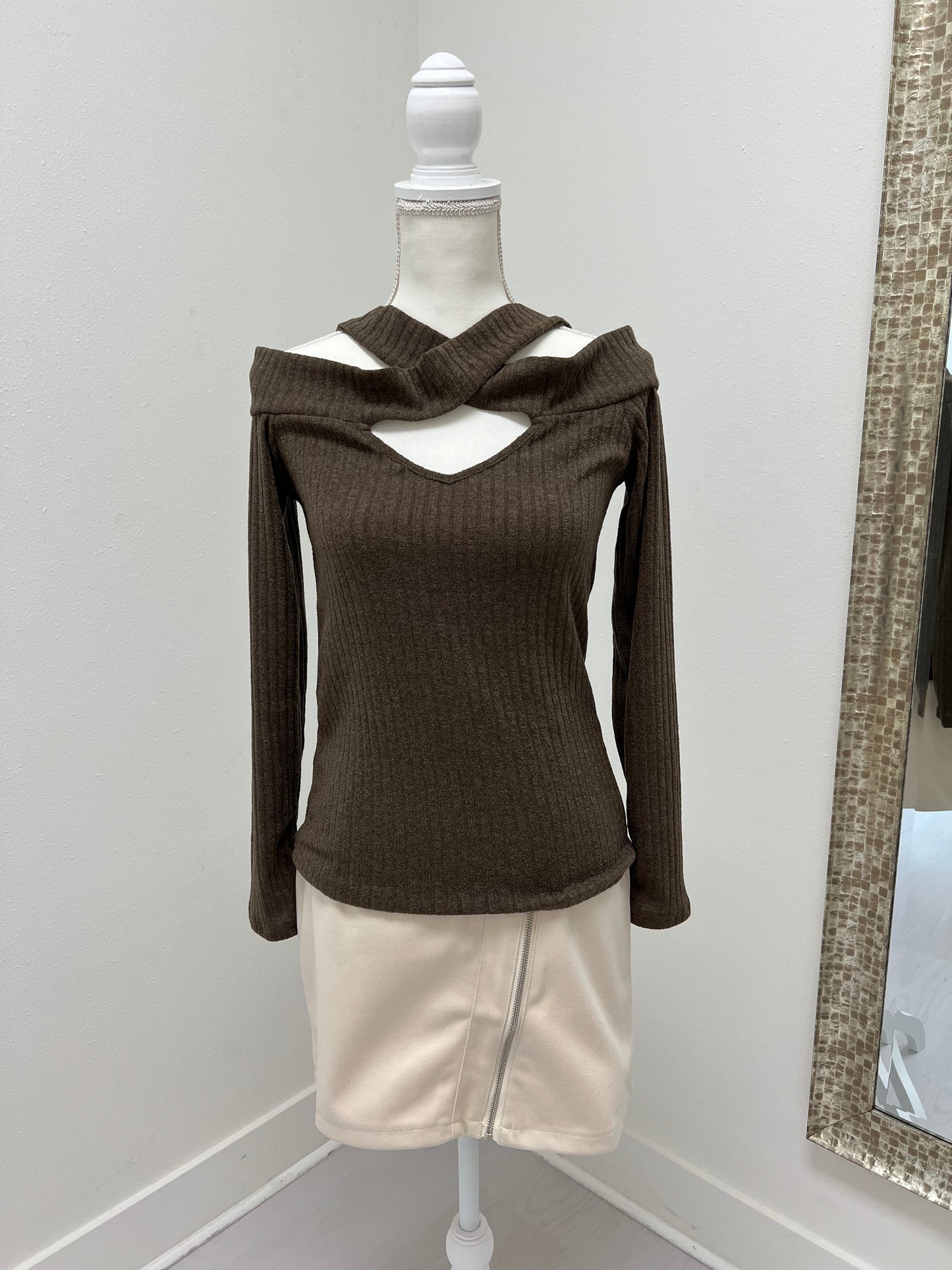 Brown top paired with cream skirt