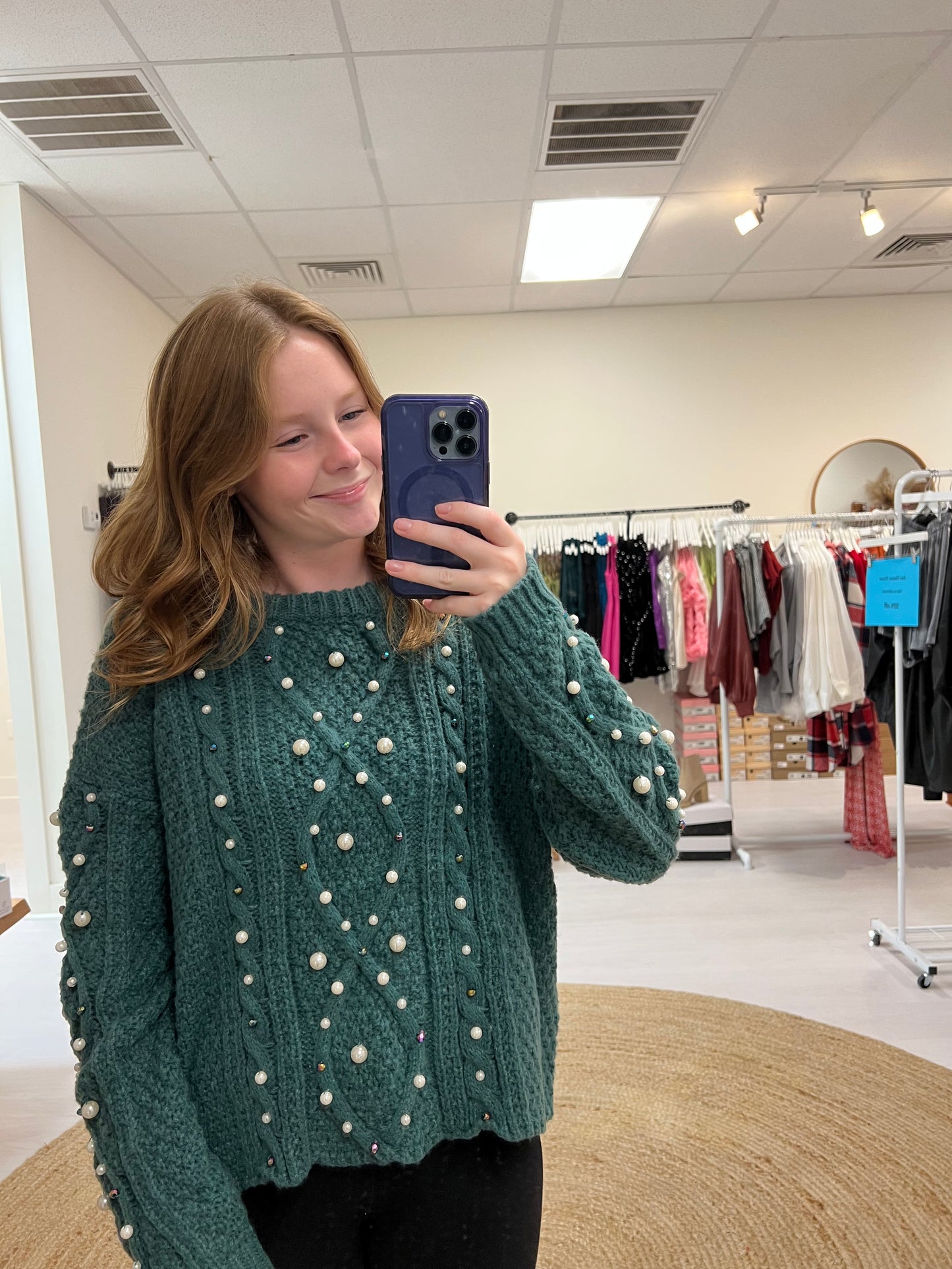 Green sweater with pearl detail