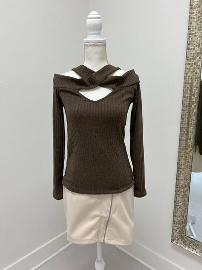 Brown top paired with cream skirt