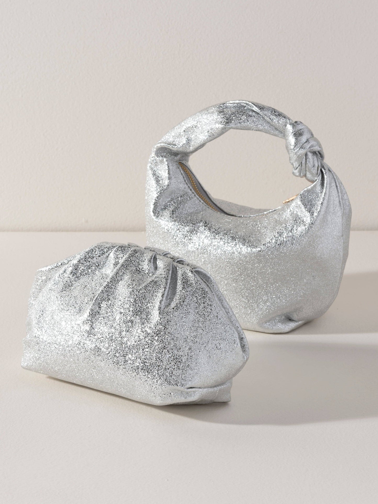 CHRISSY KNOTTED METALLIC TOP HANDLE BAG