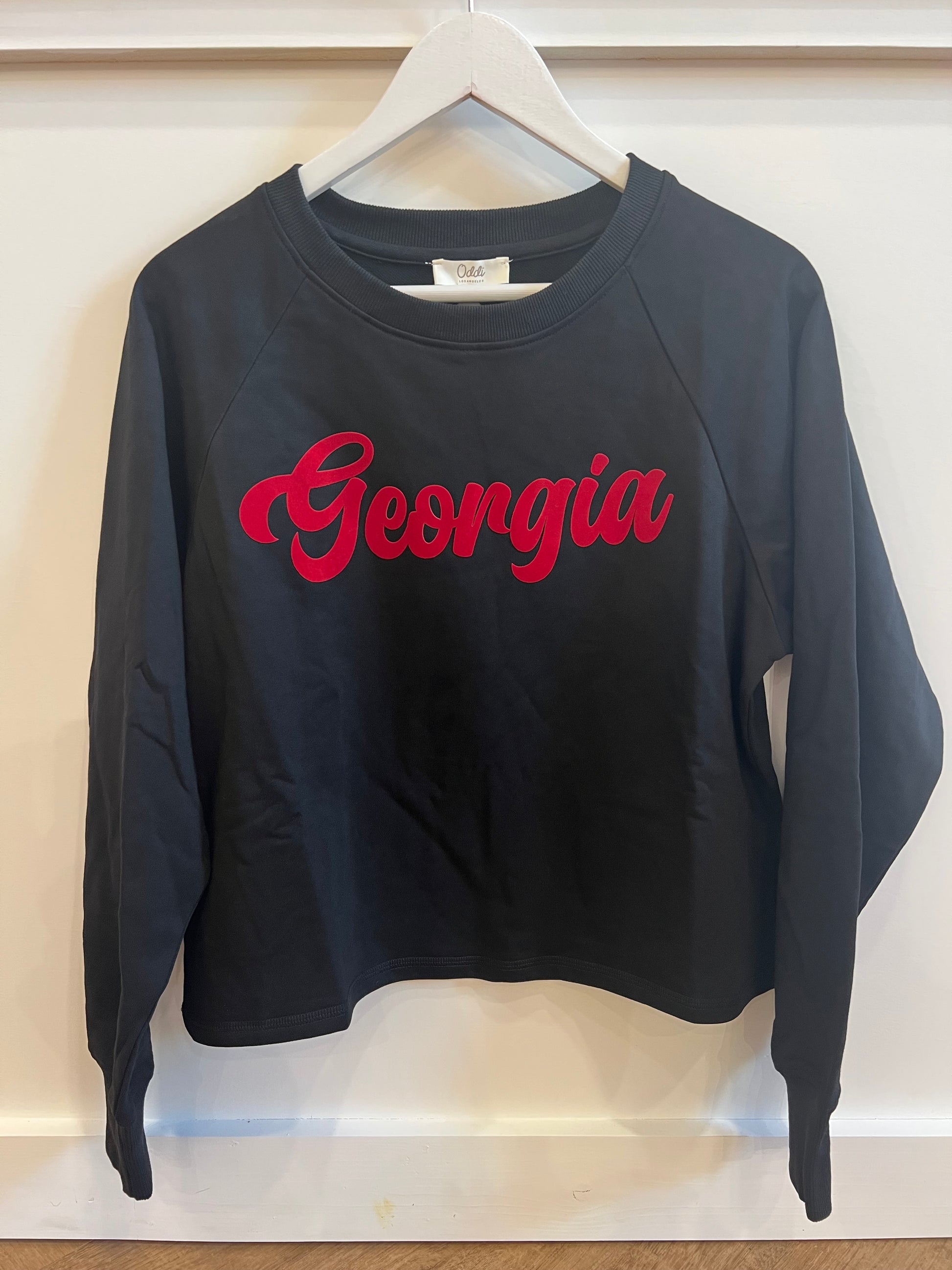 black sweatshirt with Georgia written across front