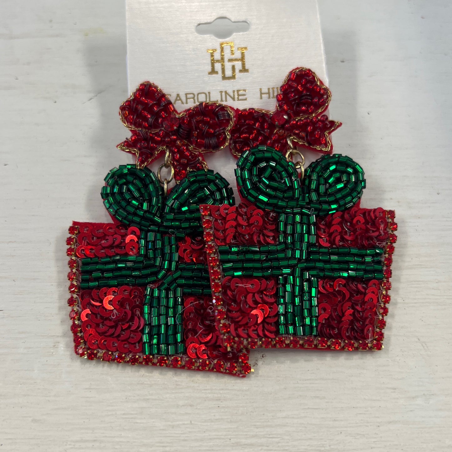 Caroline Hill present earrings