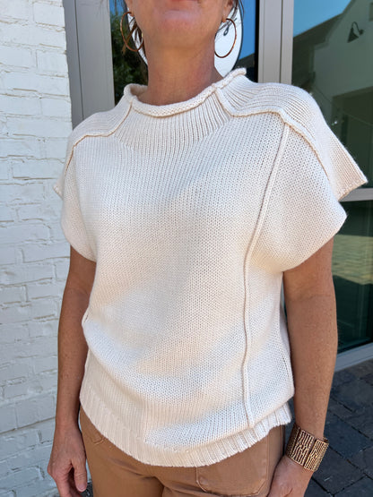 cream colored crew neck sweater