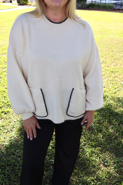 cream sweater
